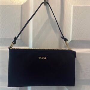 Tumi Black Clutch with Sophisticated Design